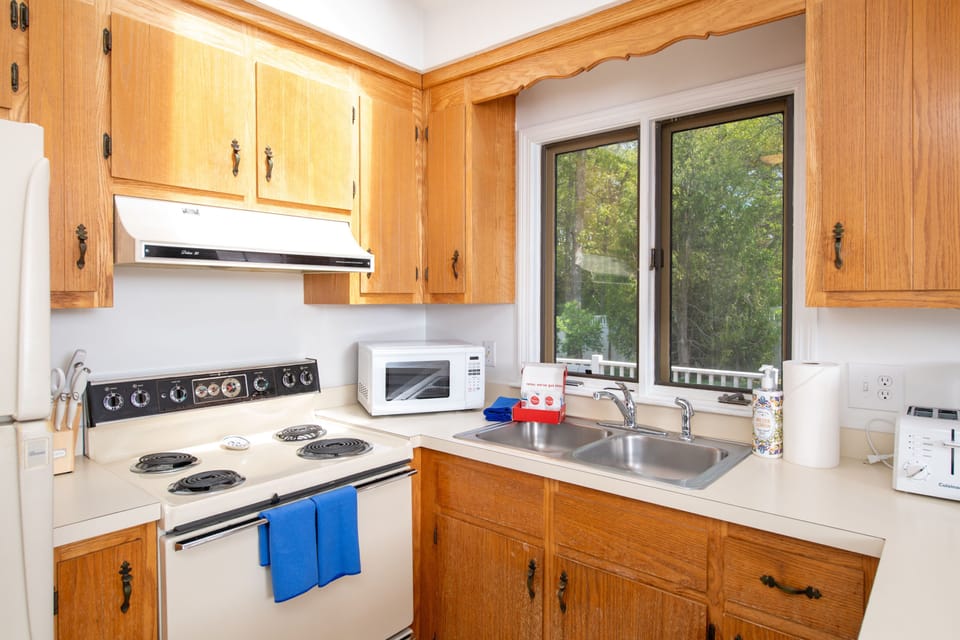 Bright kitchen with full-size appliances and everything you need for home-cooked meals.