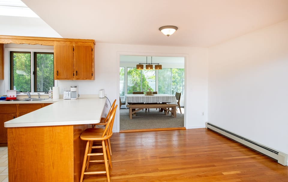 Open-concept layout keeps the kitchen connected to dining and living spaces for easy entertaining.