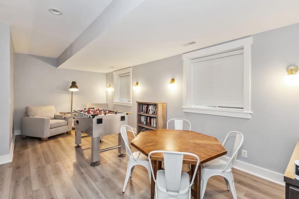 Downstairs area features a game table and foosball