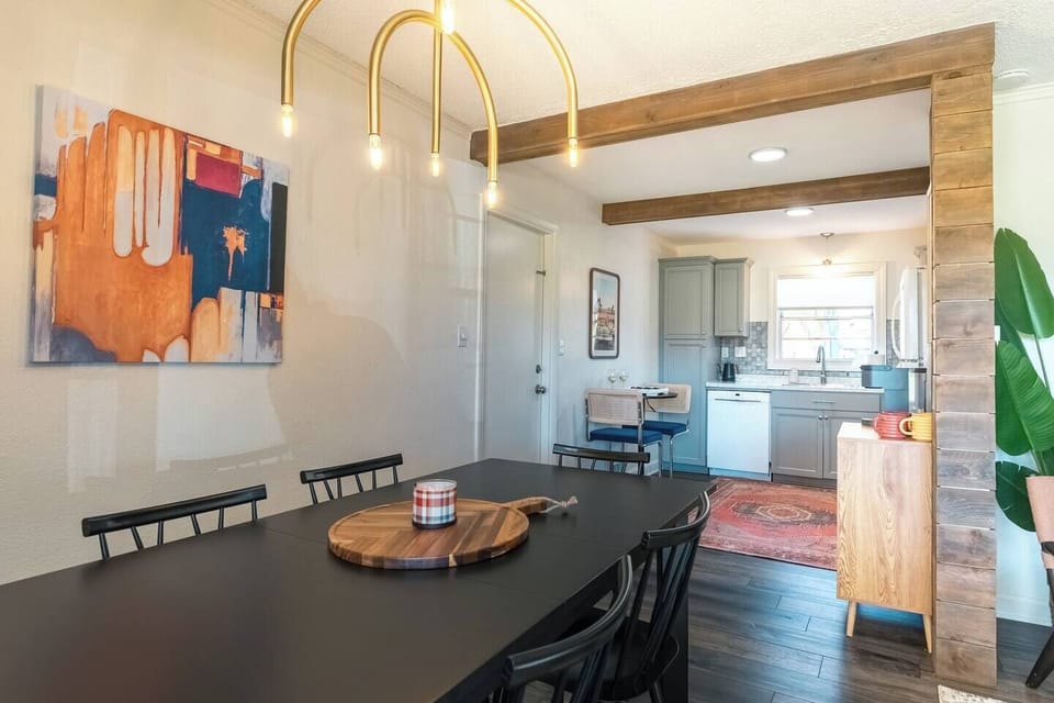 Open dining to living room & kitchen. 

Pull up a chair for a group dinner with seating for 6 plus 2 at the cocktail table in the kitchen for a total of 8. Highchair available for littles. 