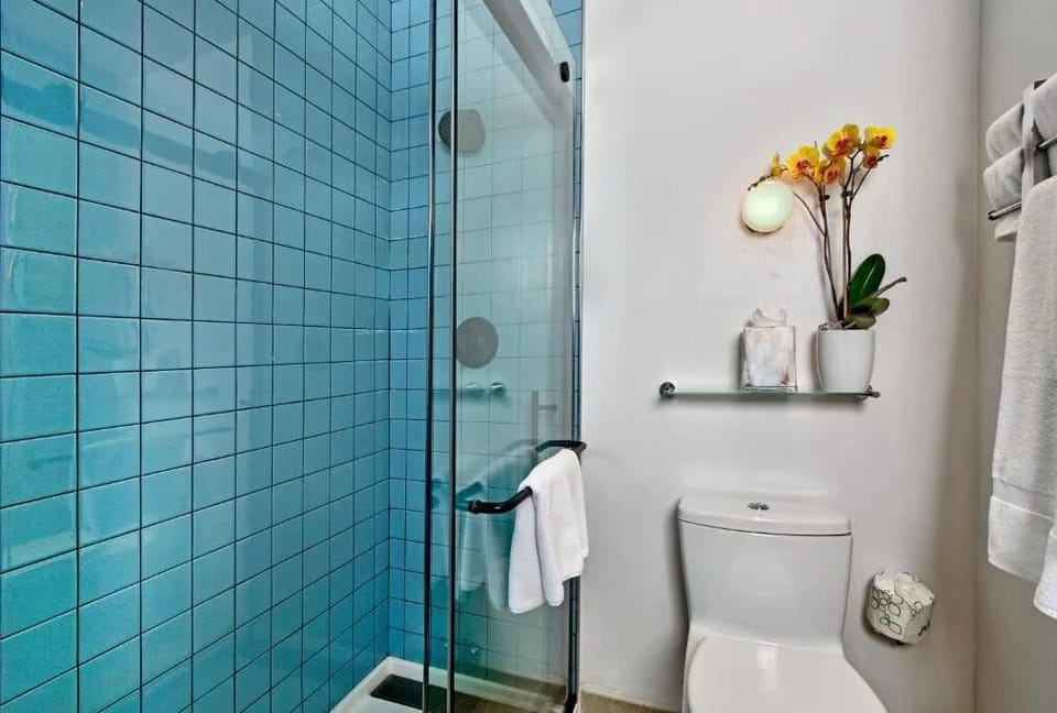Rinse off in a clean glass shower with spa-like simplicity.