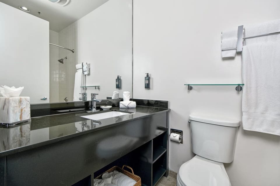 Refresh easily with bright vanity space and fluffy towels ready.