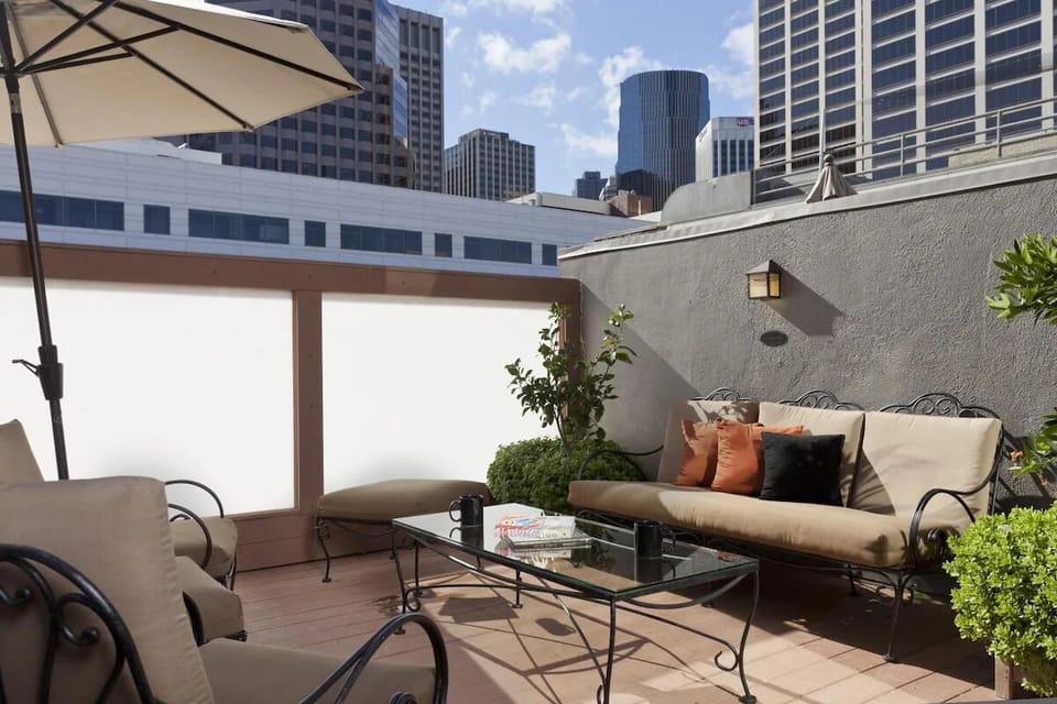 Unwind on the rooftop terrace with sunny skyline views.