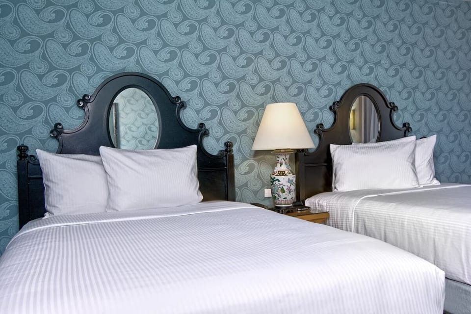 Sink into crisp linens and drift off in quiet comfort.