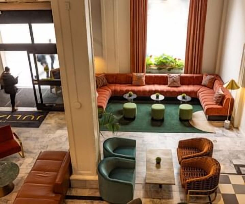 Unwind beneath soaring ceilings in this stylish social lounge.