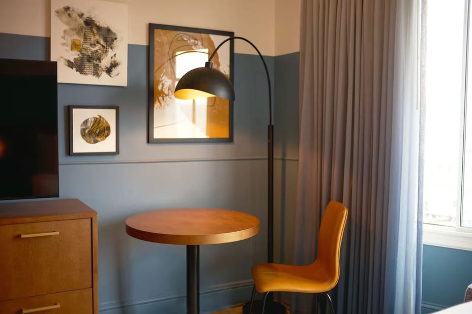 Sip coffee by the window at your cozy in-room table.