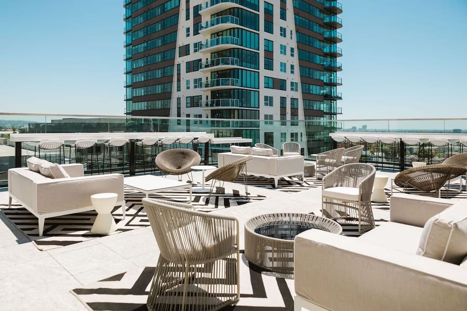 Stretch out on designer loungers with open-sky rooftop energy.