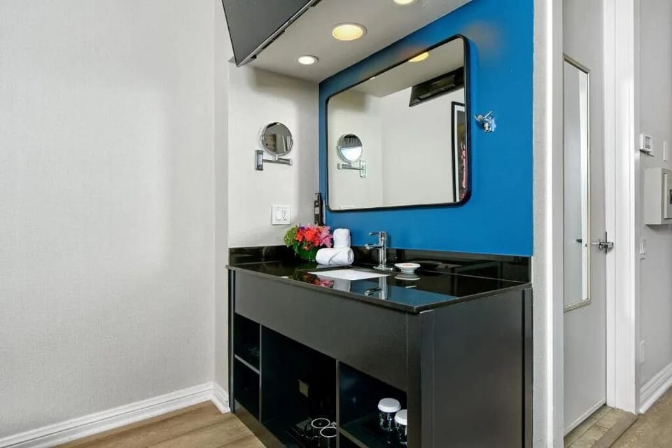 Refresh at the sleek vanity with bright mirror lighting.