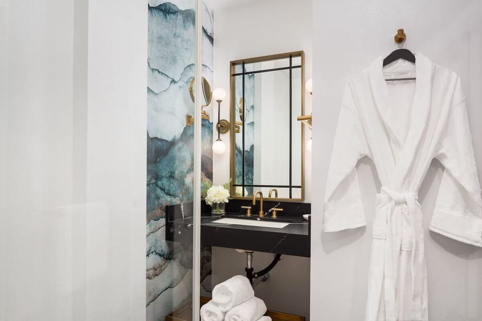 Refresh with fluffy robes and a chic, spa-like vanity.