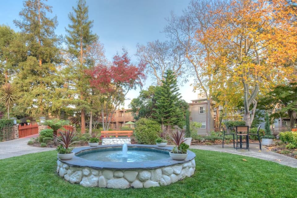 Stroll through manicured grounds and pause by the bubbling fountain.
