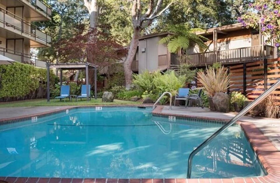 Unwind in the tranquil pool surrounded by lush garden shade.