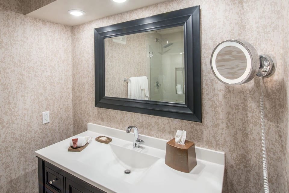 Get ready easily at the bright vanity with generous counter space.