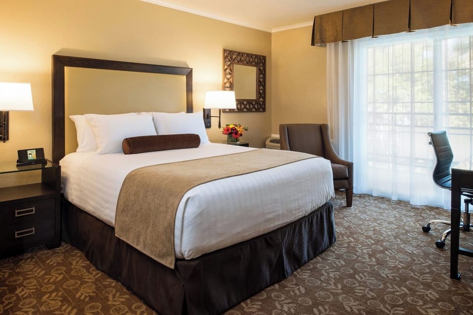 Unwind in crisp linens and warm, restful ambience.