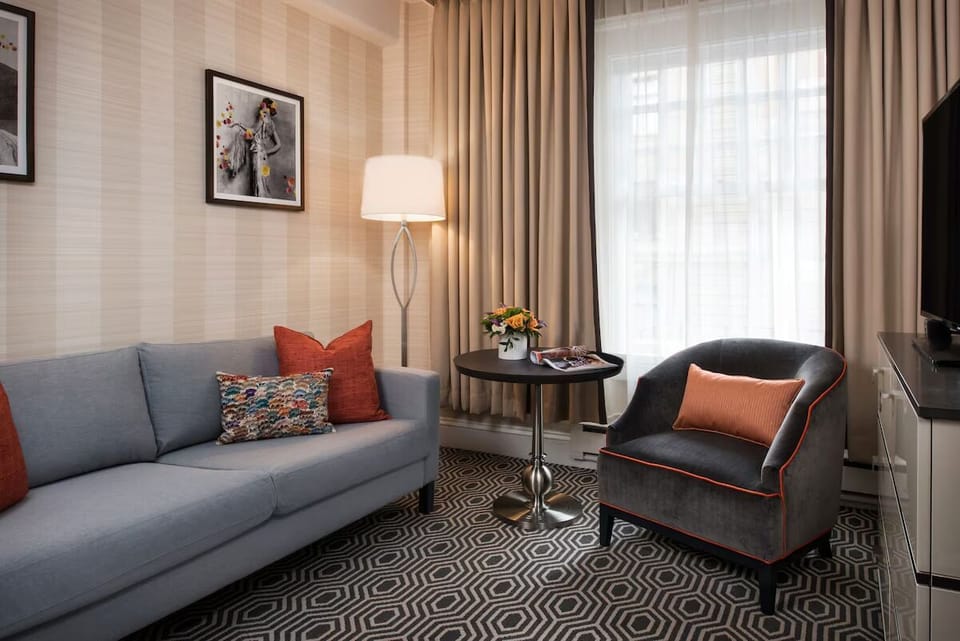Lounge comfortably on the sofa with sunlight streaming through drapes.