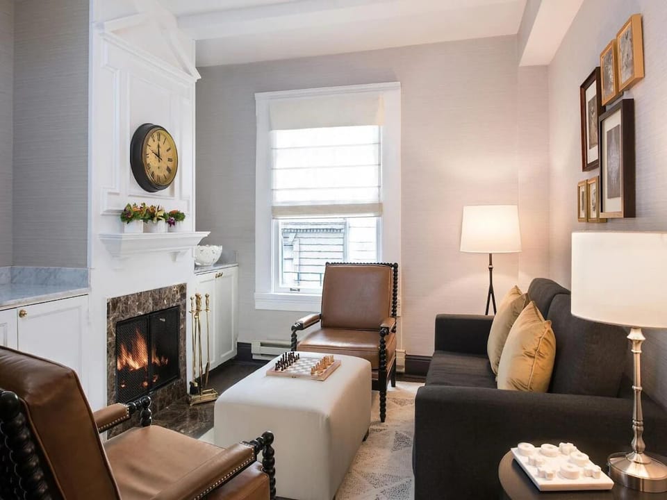 Unwind by the glowing fireplace after a day exploring downtown.