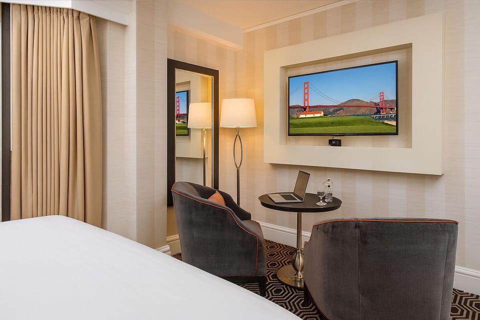 Kick back with big-screen entertainment and an intimate bistro table.