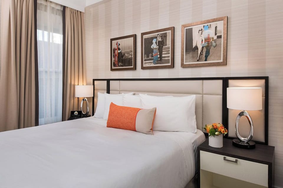 Unwind into crisp linens and warm bedside glow tonight.