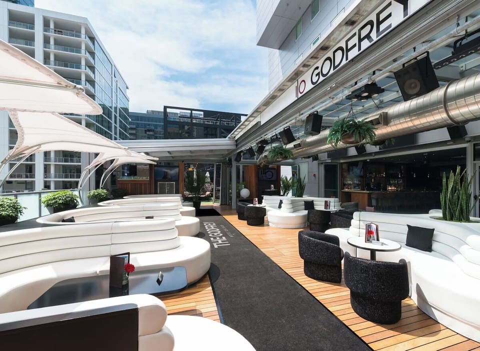 Kick back on the rooftop deck with cocktails and skyline vibes.