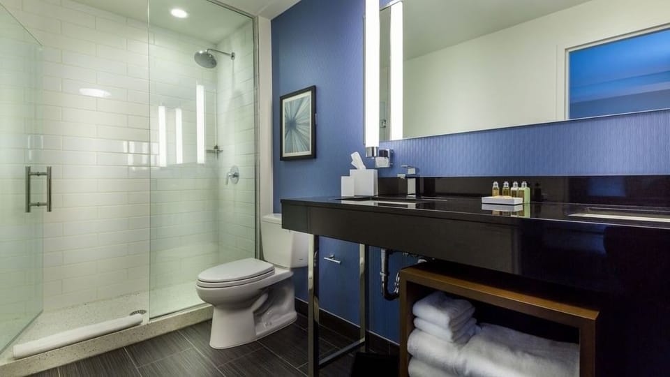 Refresh in a spotless, spa-like bath with glass shower.