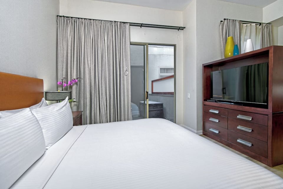 Settle in for a restful night with TV and ample storage.