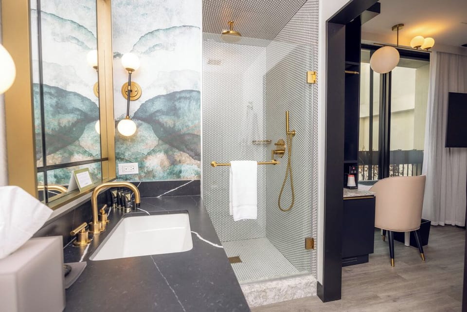 Ease into the evening with spa-style shower and sleek vanity.