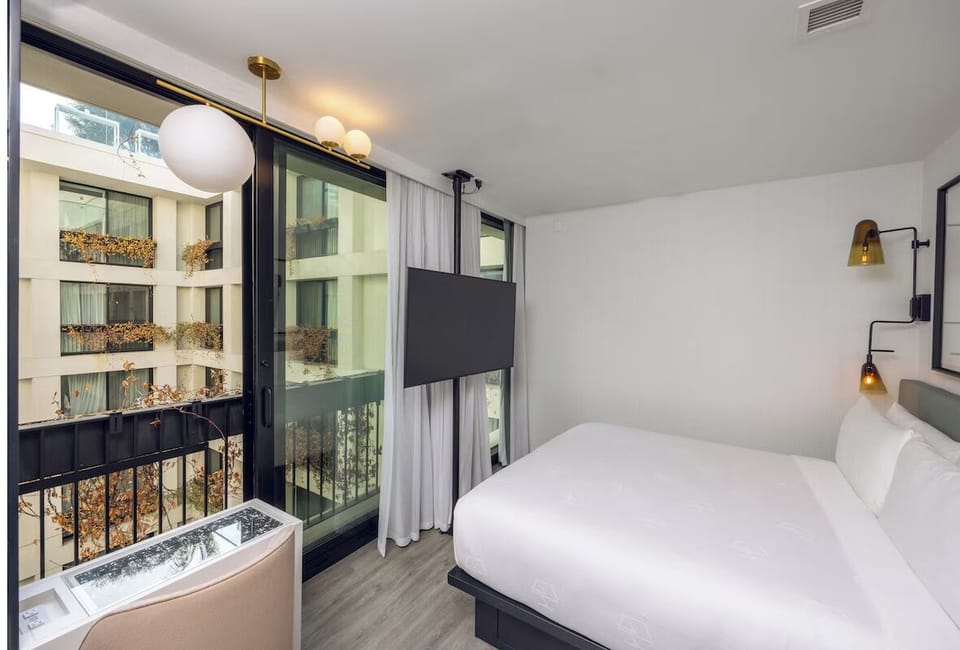 Wake up to courtyard light and step onto your balcony.