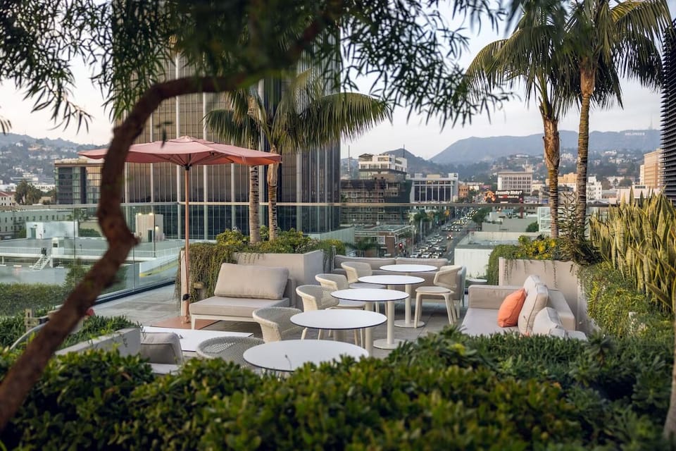 Relax among palms and greenery high above the neighborhood bustle.