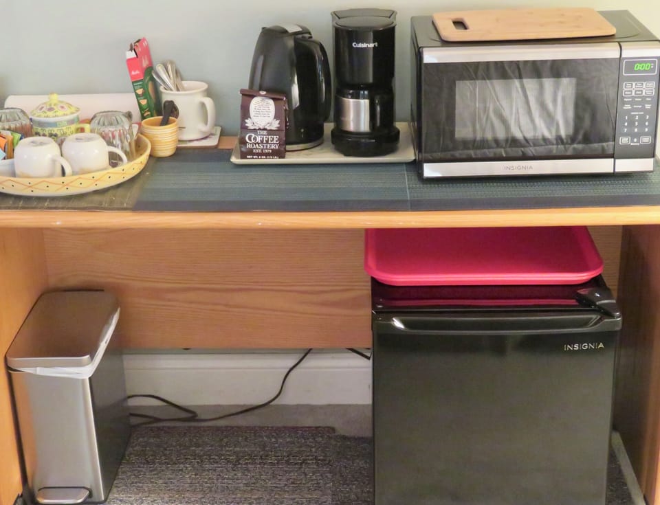 Mini fridge, microwave, electric kettle, codffee maker.