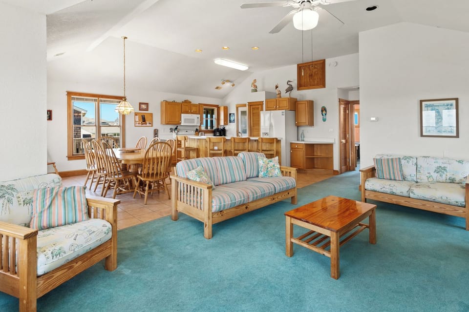 Relax in the spacious Living Area on the Main Level with lots of natural light! (Note: Fireplace is not for guest use)
