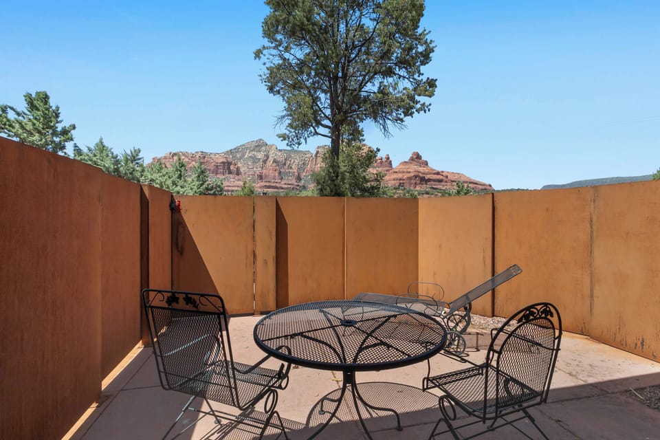 Patio with awe inspiring views. Patio table with seating for two, Lounge for sunbathing.