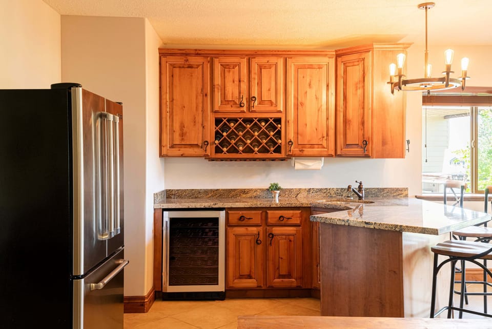 Lower level family room kitchenette with bar seating