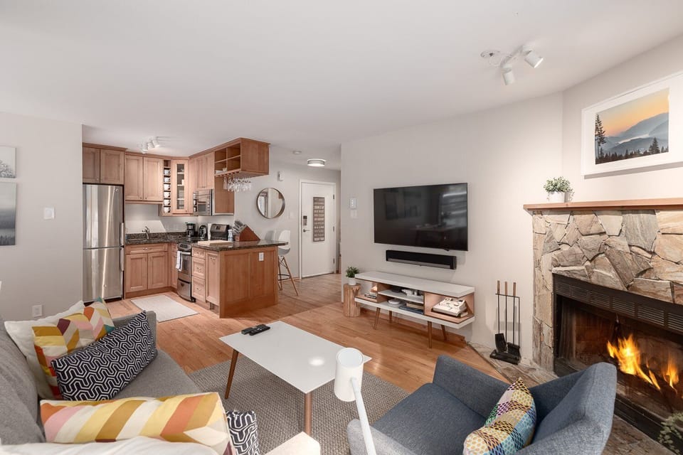Spacious and sunlit, the living room is perfect for relaxing with friends or family.
