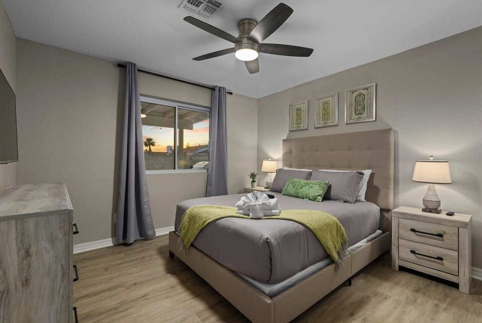Second bedroom with a queen size bed & private smart television.