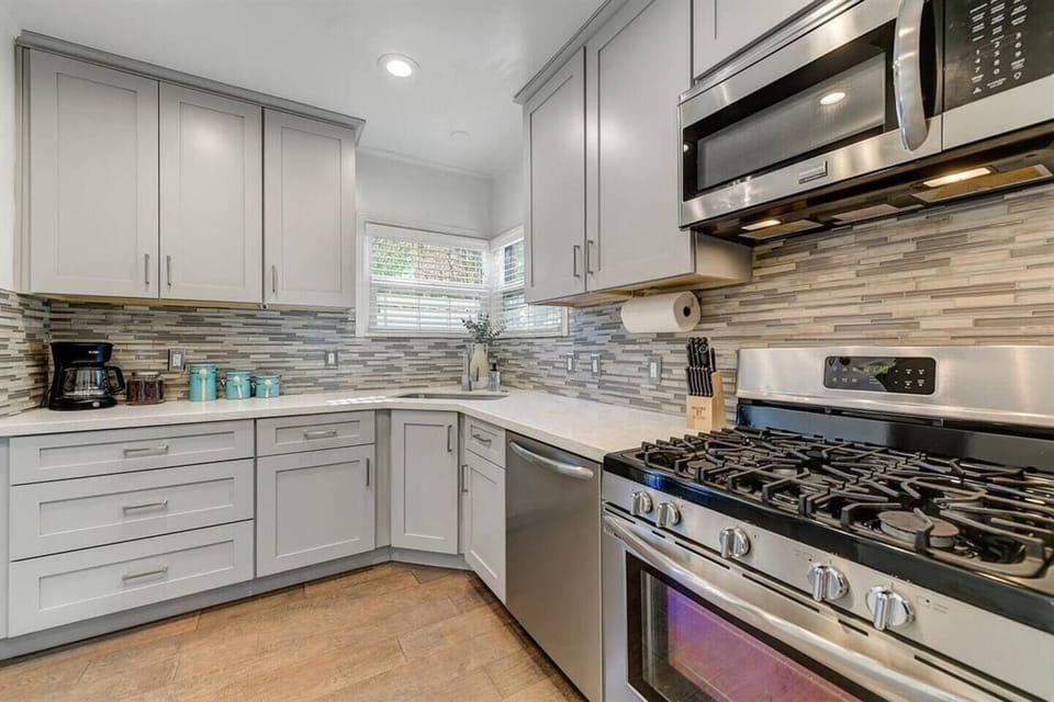Fully Equipped kitchen, with refrigerator, gas stove, microwave and dishwasher.  All necessities to cook are present!