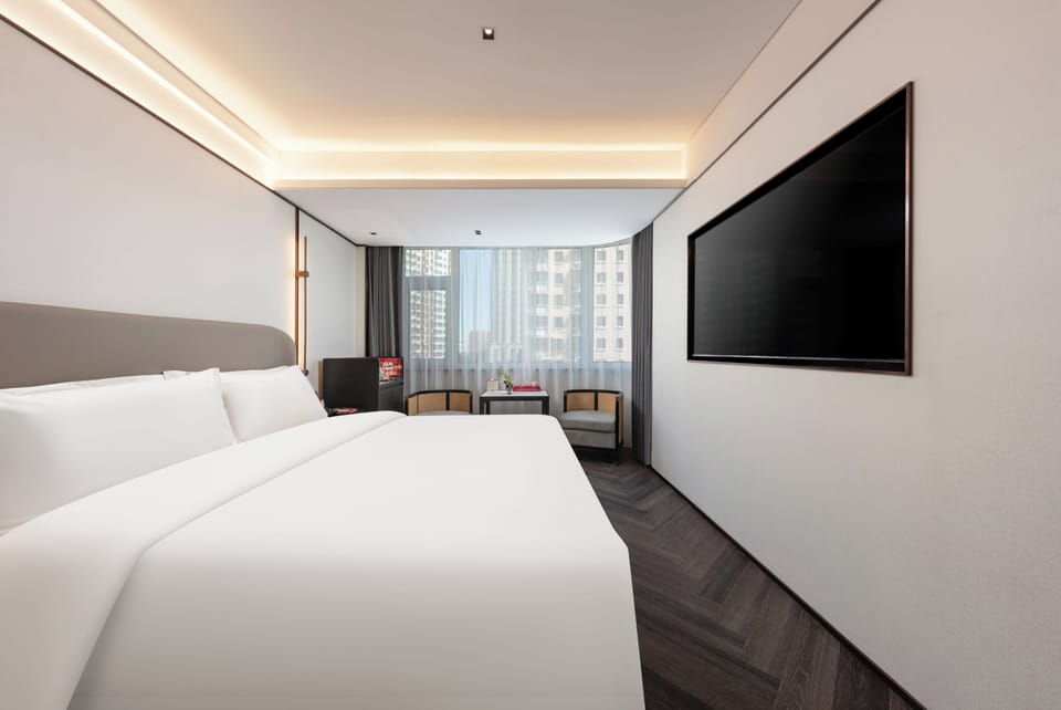 Bishan king room | Down comforters, desk, laptop workspace, blackout drapes