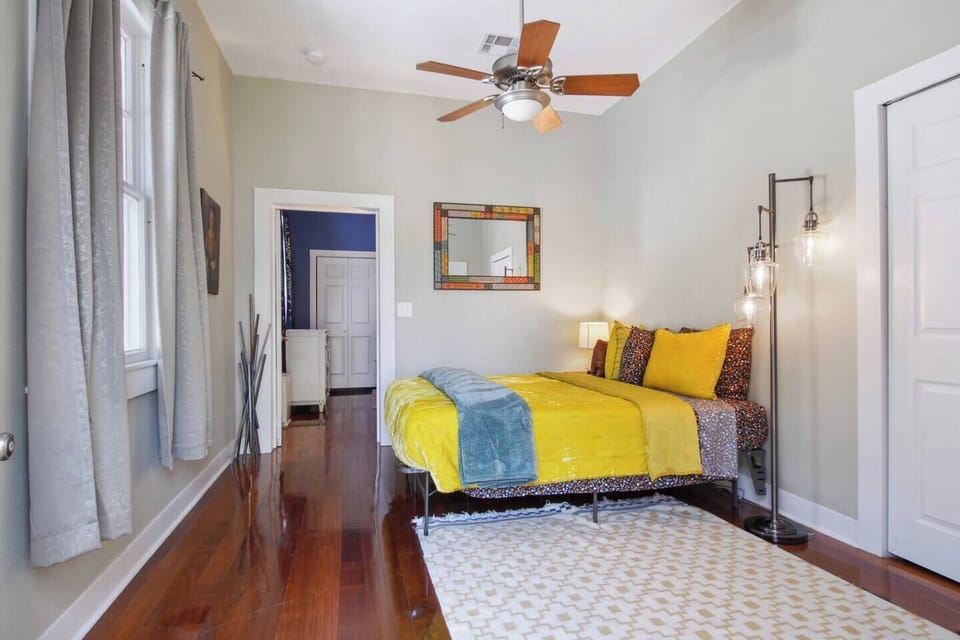 Master bedroom with cozy queen bed, closet, and private en suite bathroom.