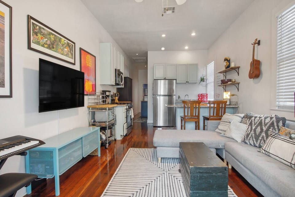 Jam on the keyboard or guitar, enjoy the 50" Roku TV, games, and vibrant eclectic art