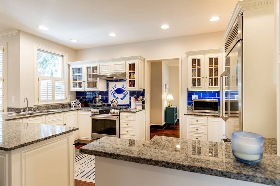 The stunning kitchen has been renovated to include all high-end stainless steel appliances.