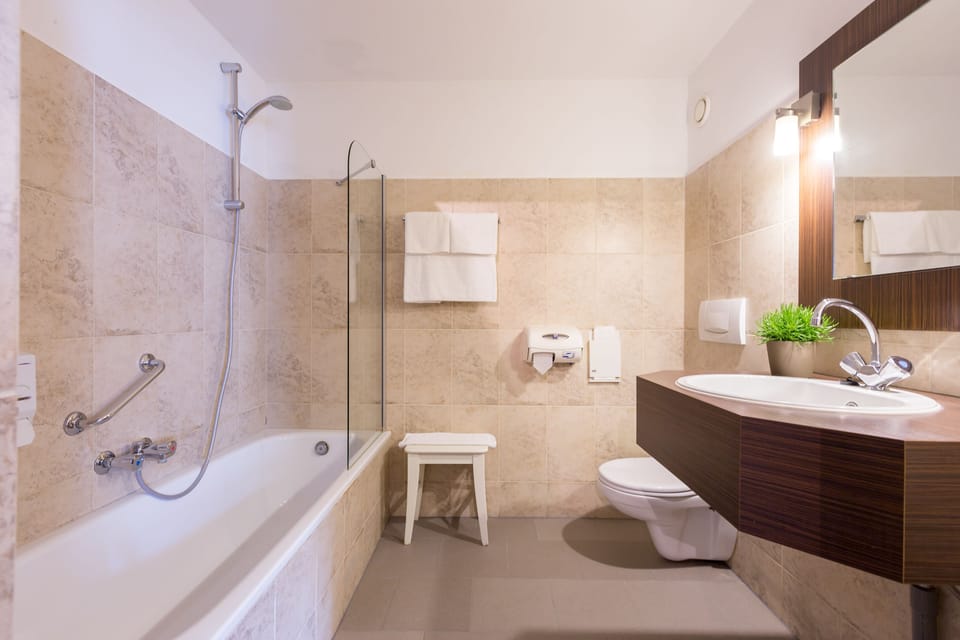 Combined shower/tub, hair dryer, towels, soap