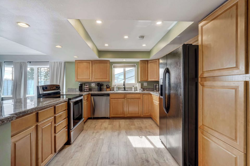 Spacious kitchen with modern appliances, ample counter space, and a seamless flow to the dining area—perfect for preparing meals and gathering with loved ones.