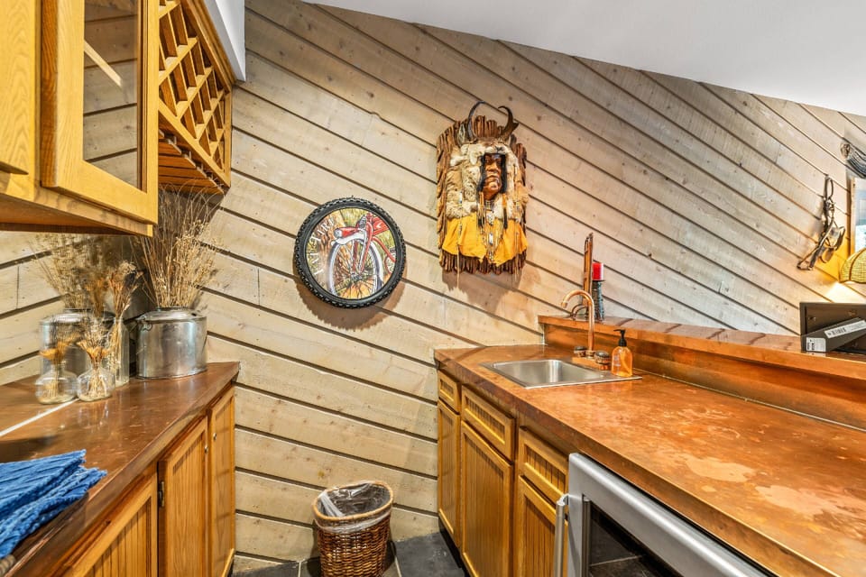 Wet bar located next to the dining and living area.