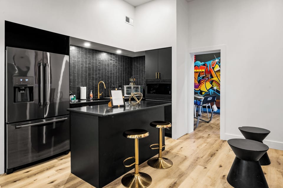 Shared kitchenette with barstool seating, pool table, and seating - perfect for relaxed gatherings!