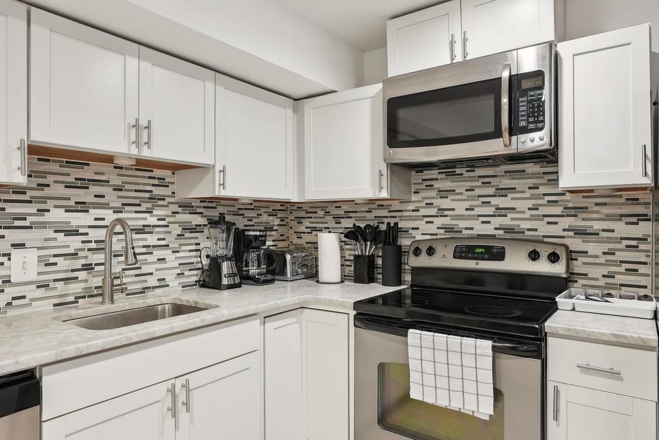 Unit features a full kitchen with dishwasher and full size stove