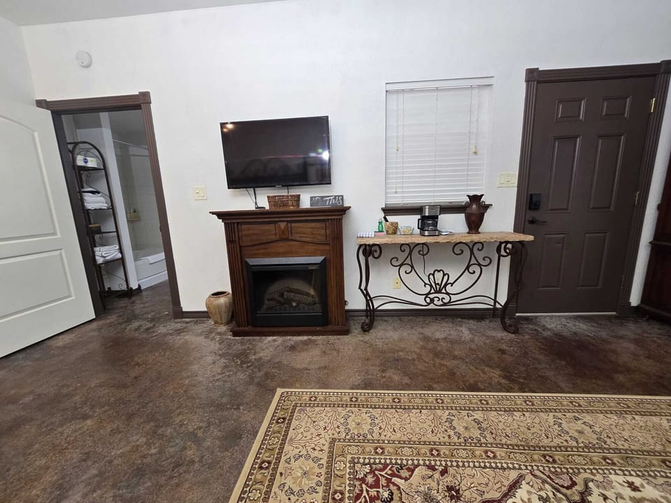Enjoy a stylish space with a cozy fireplace and elegant décor!