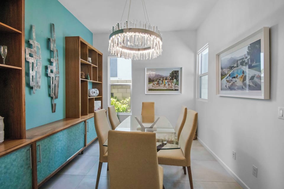 Elegant dining area with seating for six and modern lighting