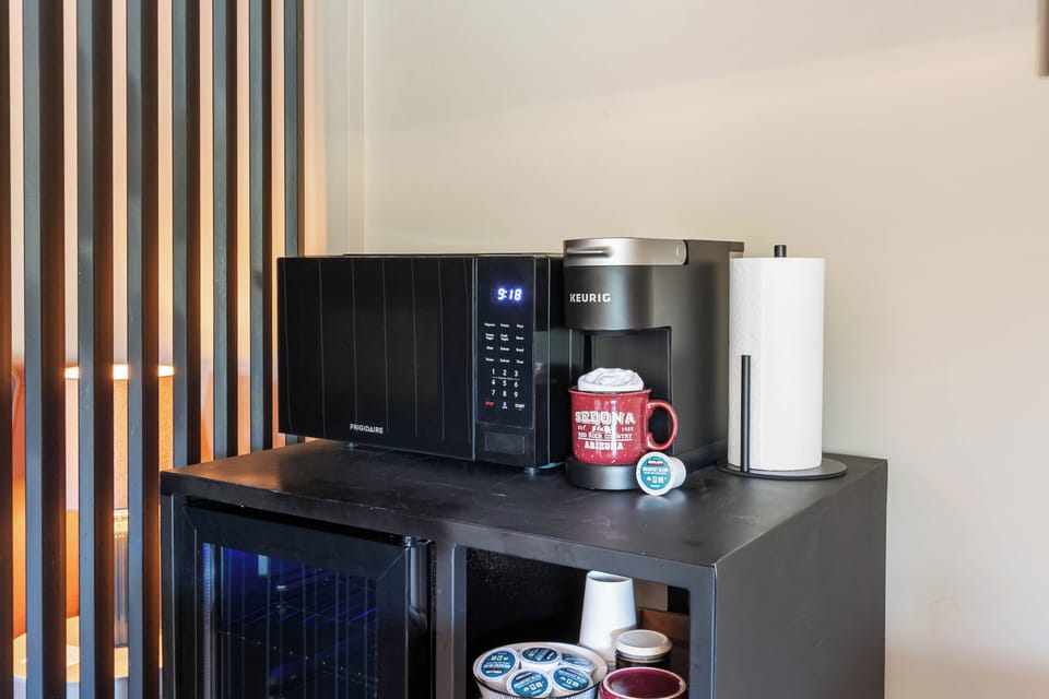 Coffeemaker, wine/mini fridge, and microwave.