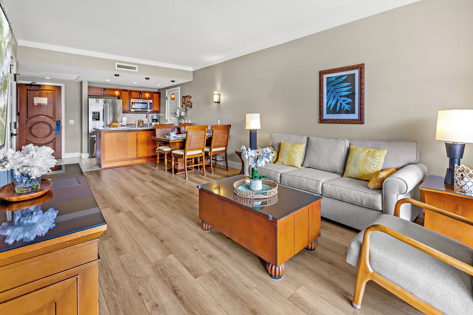 Unwind in your spacious open-concept suite with elegant furnishings, full kitchen, and comfortable seating perfect for relaxing after exploring.