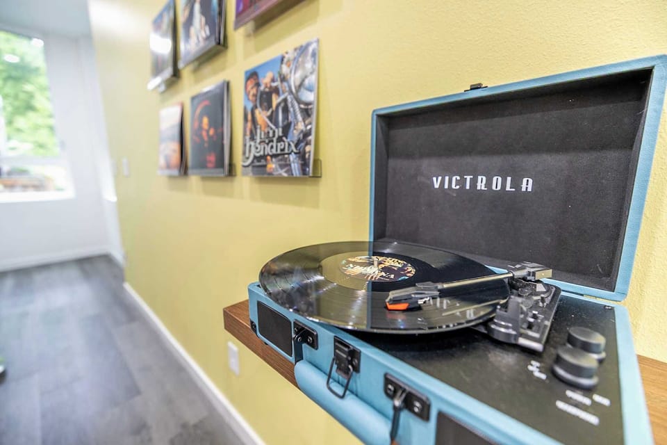Drop the needle and let the vibes take over. This vinyl wall and record player setup is your excuse to slow down, turn up the volume, and soak in the sound. No skips, just good energy from the moment you hit play.