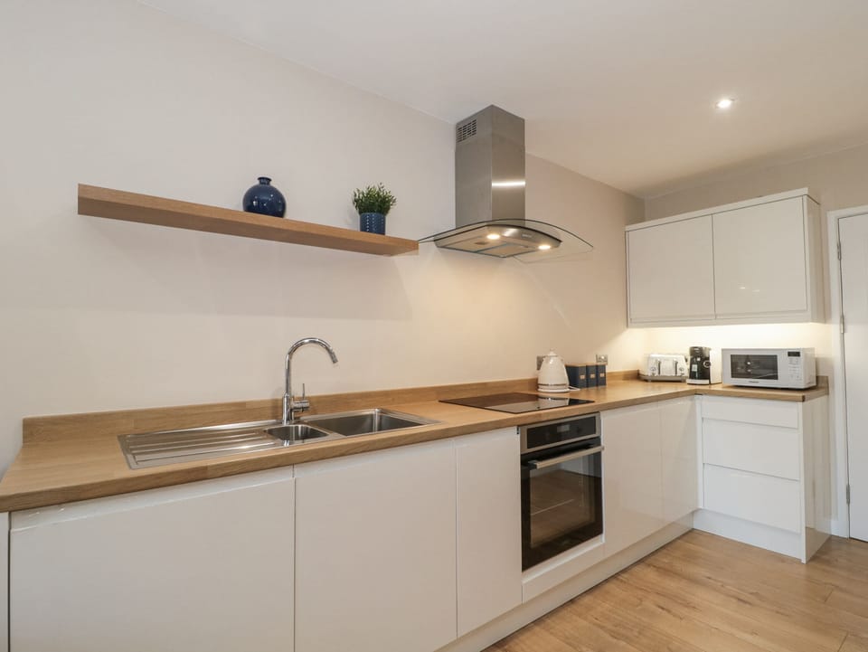 Fridge, microwave, cookware/dishes/utensils