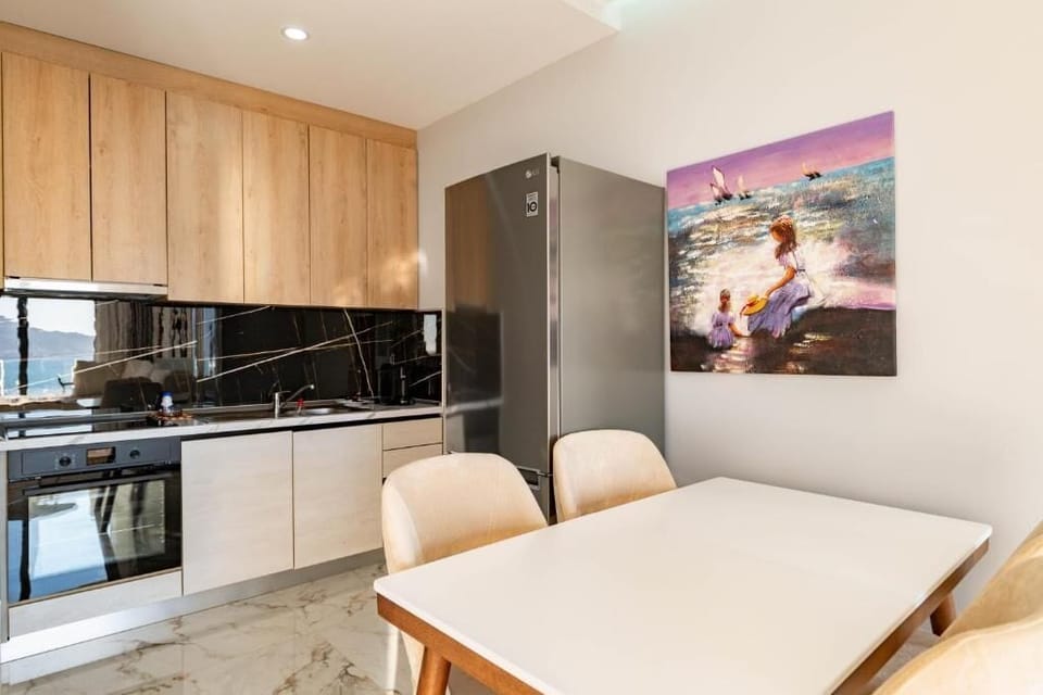 Deluxe Apartment, 2 Bedrooms, Sea View | Private kitchen | Fridge, dishwasher, cookware/dishes/utensils